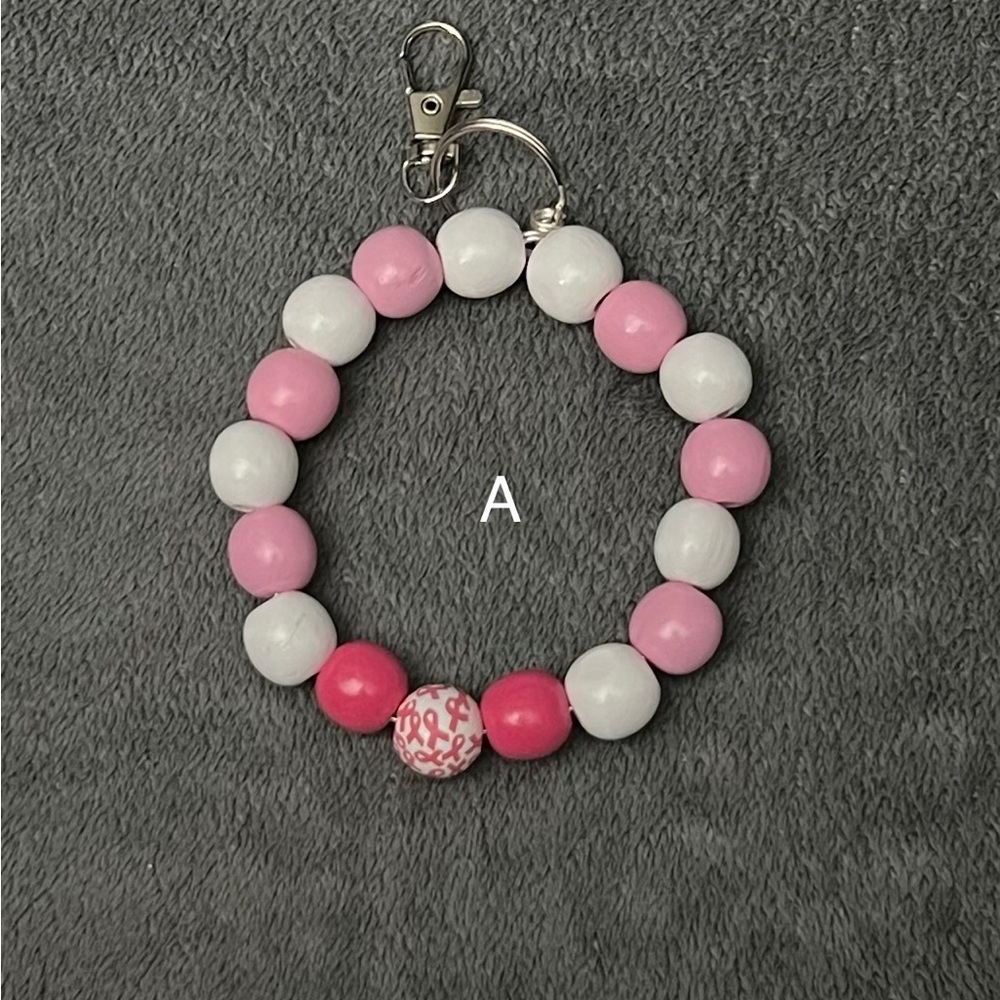 Handcrafted pink and white with breast cancer beads.